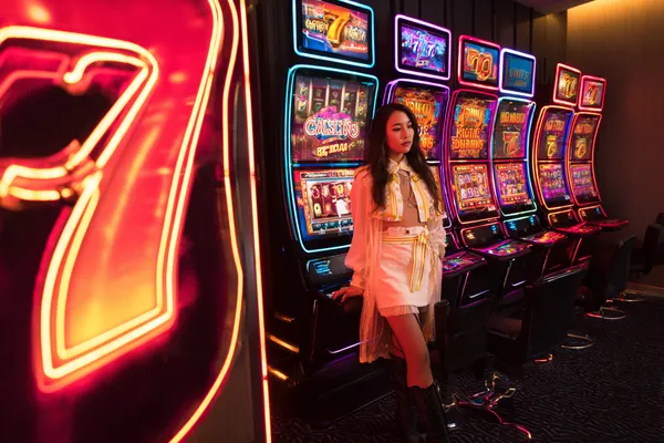 A confident dealer surrounded by casino chips inviting players to access their BANGBEF account, reflecting quick and easy login options.